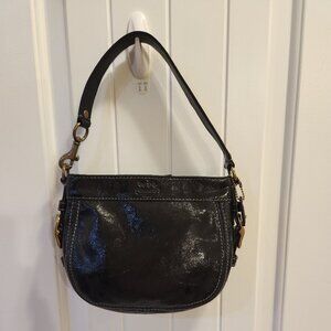 Coach Signature Zoe Black Patent Leather handbag with Deep Orchid lining